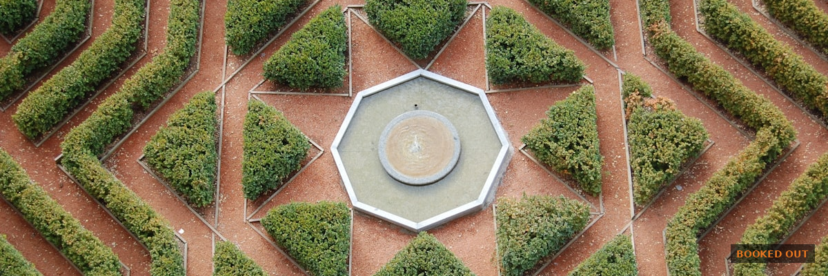 Landscaping company landing page on a laptop with a quote request form open